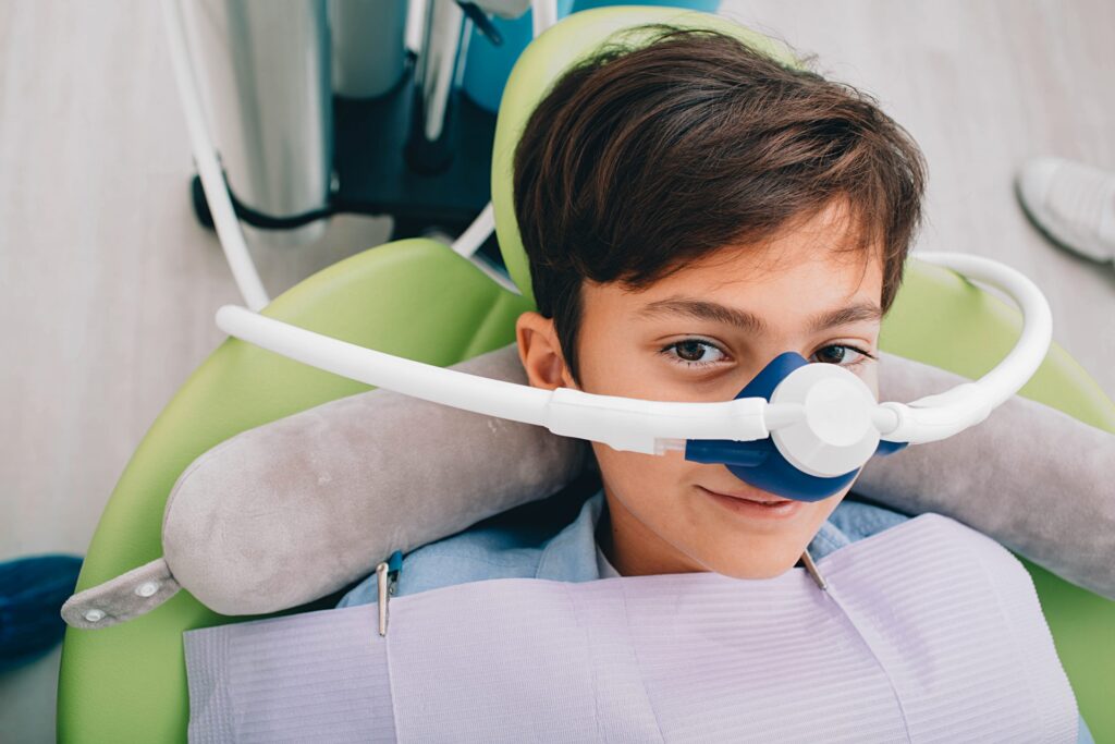 Smiling patient receiving happy gas sedation