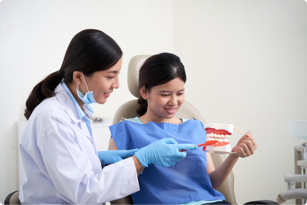 Young child smiling during pediatric dental appointment
